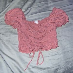 Pink ruffle sleeved shirt, with tie at bottom from Garage, Size Small.